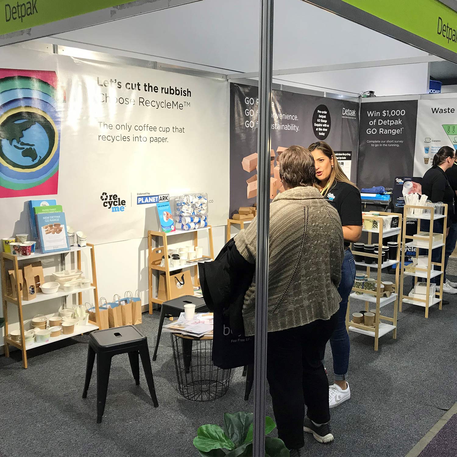 Image of stand at FoodService Australia with RecycleMe banner in background