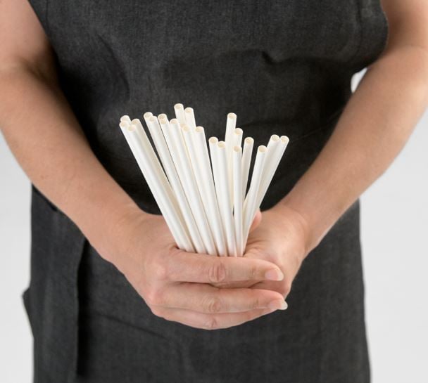 Image of paper Endura straws being held