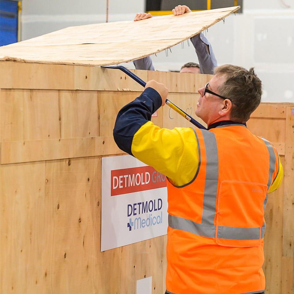 Image of someone opening a Detmold Medical box with new machines