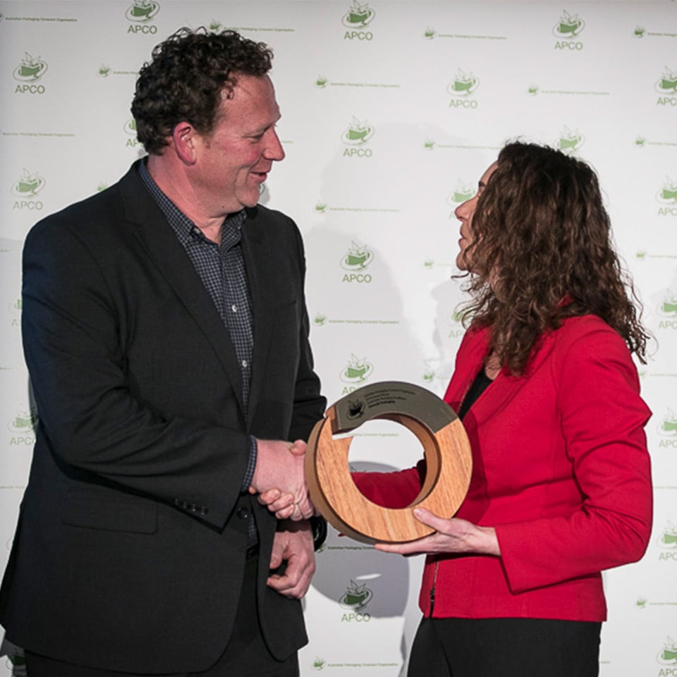 Image of Tom accepting award for Sustainable Packaging Excellence