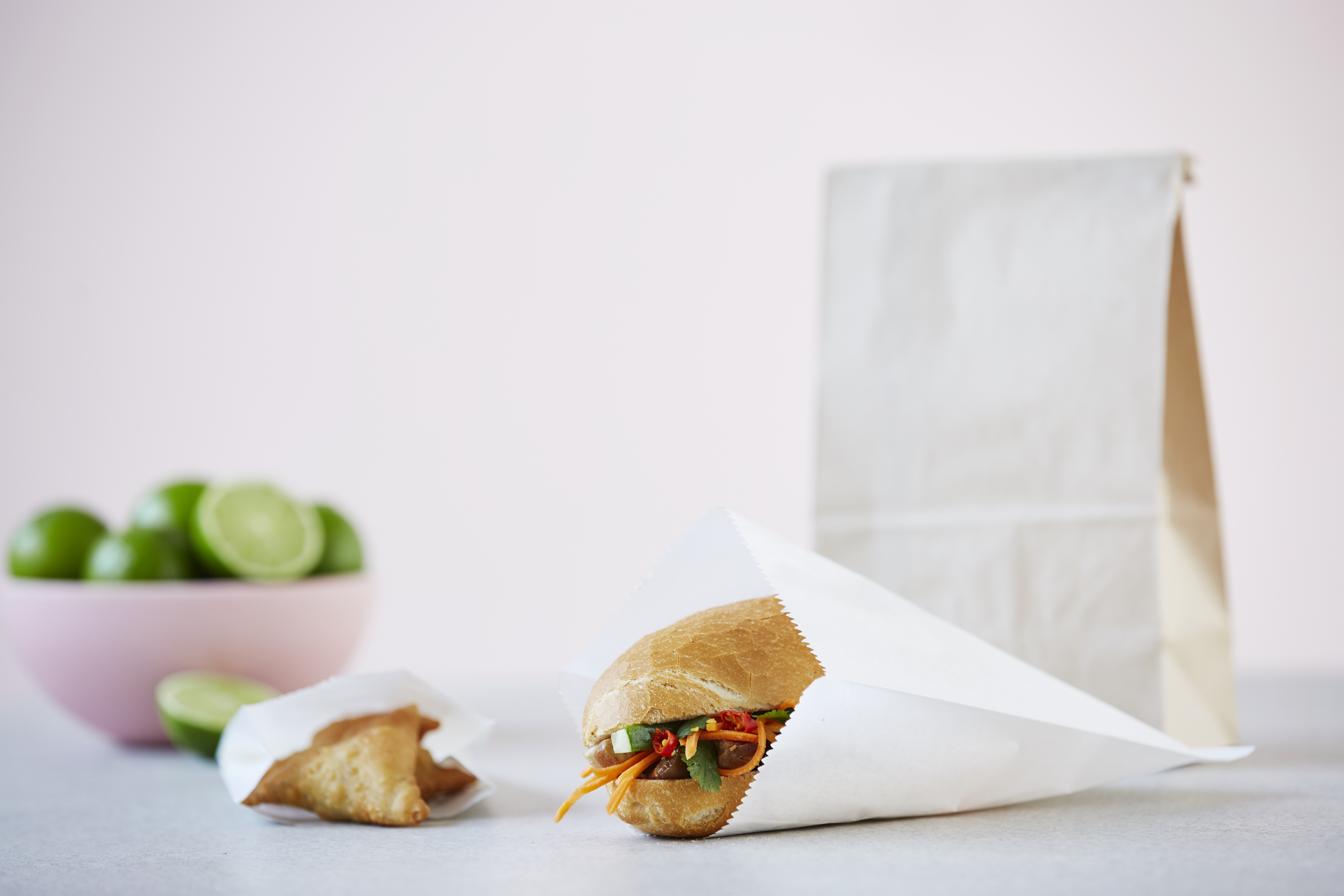 Lunch roll packaged in white paper flat bag. 