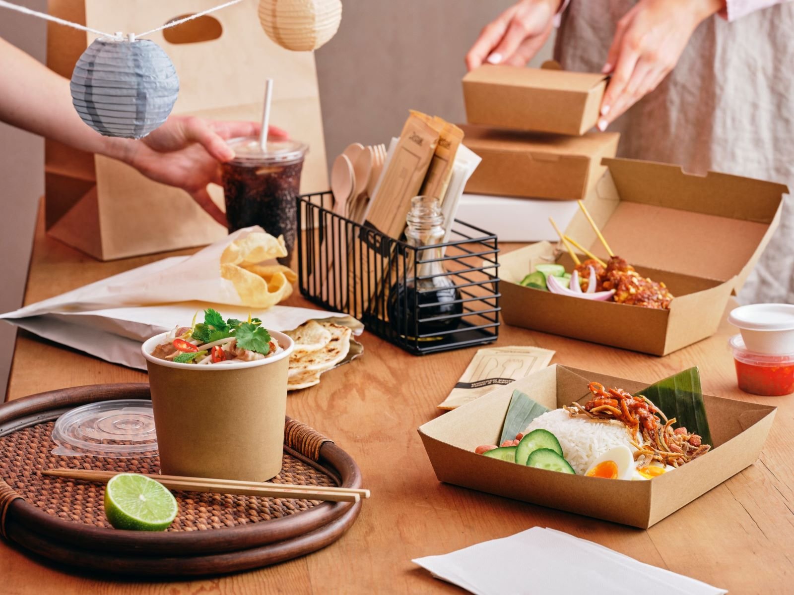 Asian food served in paper and board packaging products.