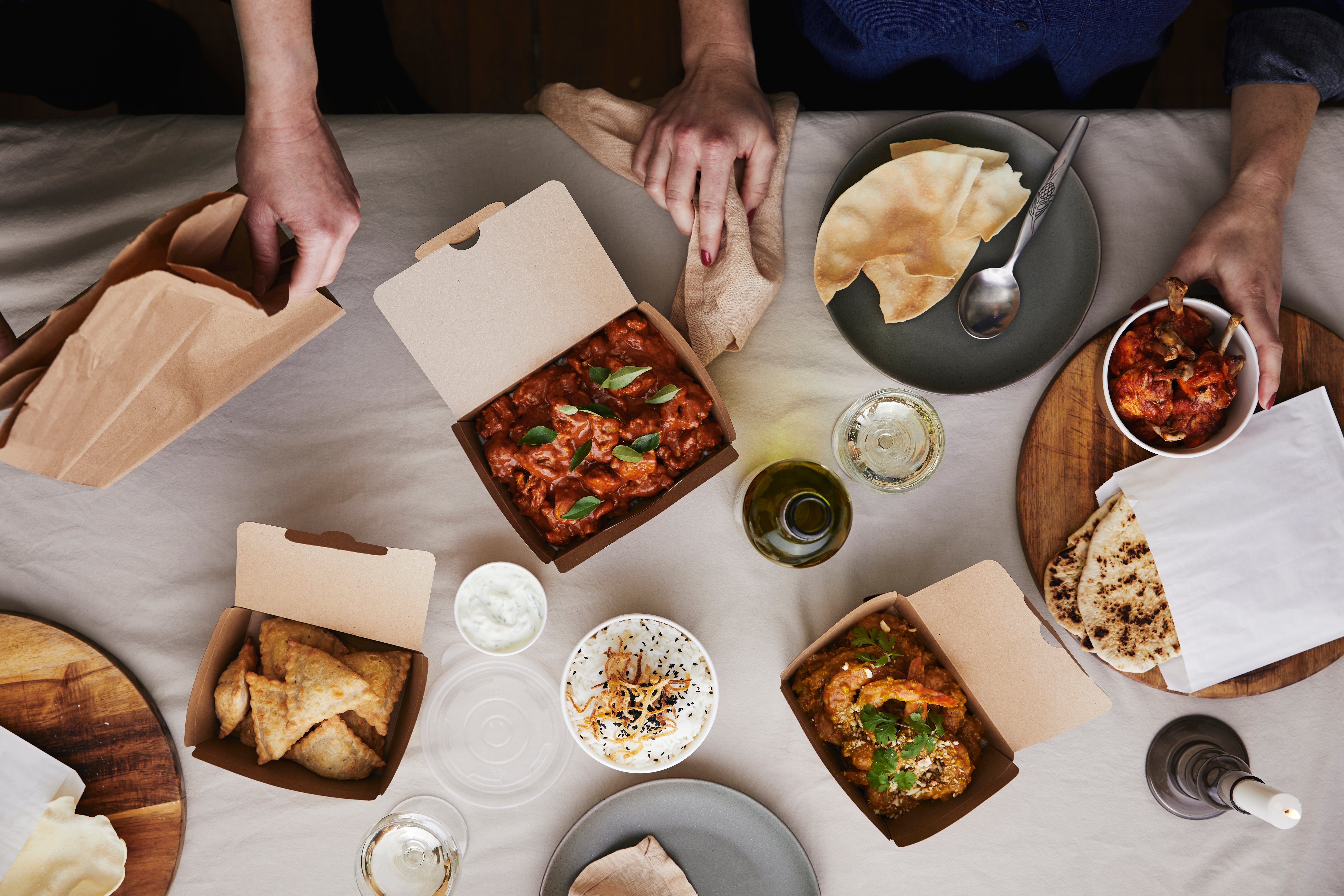 Takeaway food shared for dinner at home.