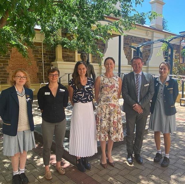 Image of students and staff at Loreto College and Detpak representatives to cut the rubbish