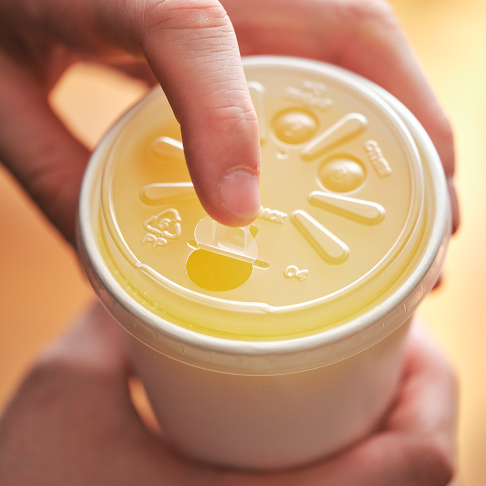 Detpak's innovative strawless lid is perfect for cold beverages on the go