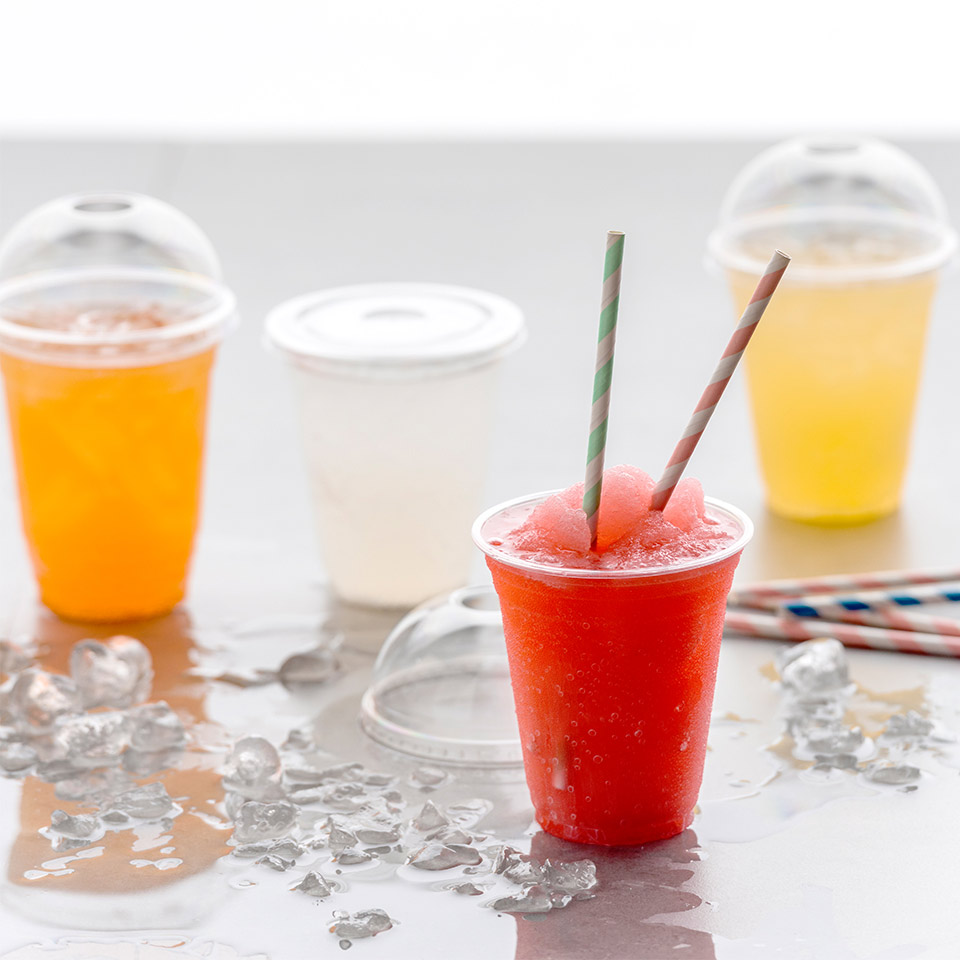 Image of three of Detpak's Clear Recyclable Cups filled with bright liquids