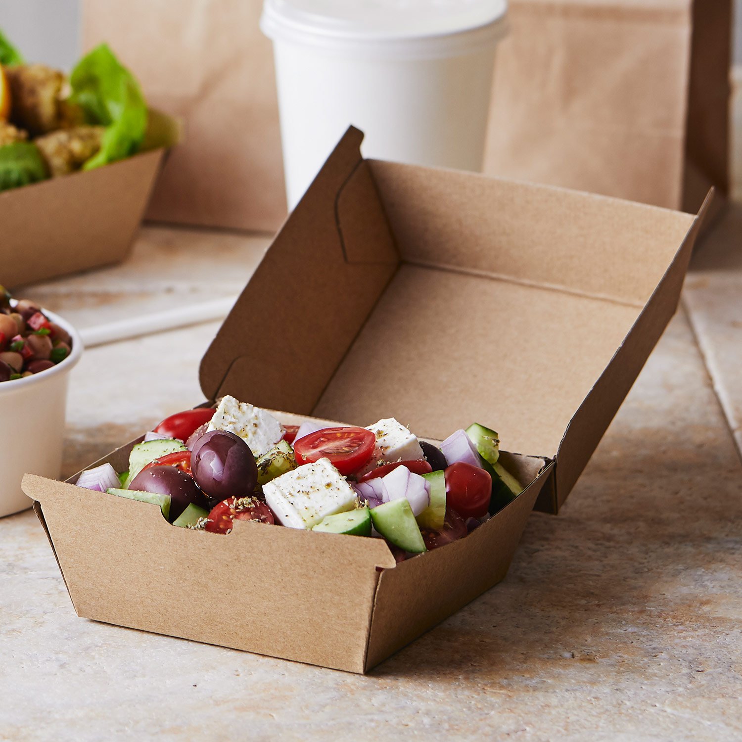 Image of Detpak Endura carton manufactured with recycled content, with greek salad. 