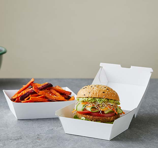 Detpak endura cartons filled with a burger and sweet potato fries.