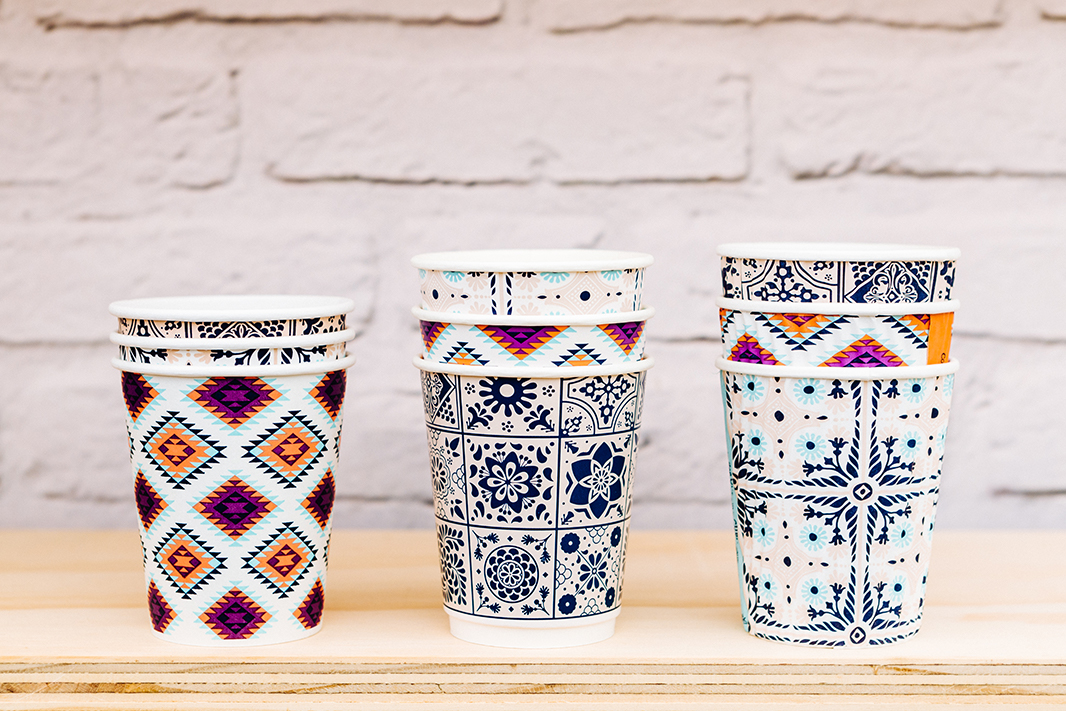 Stacked colourful Coffee Origins cups