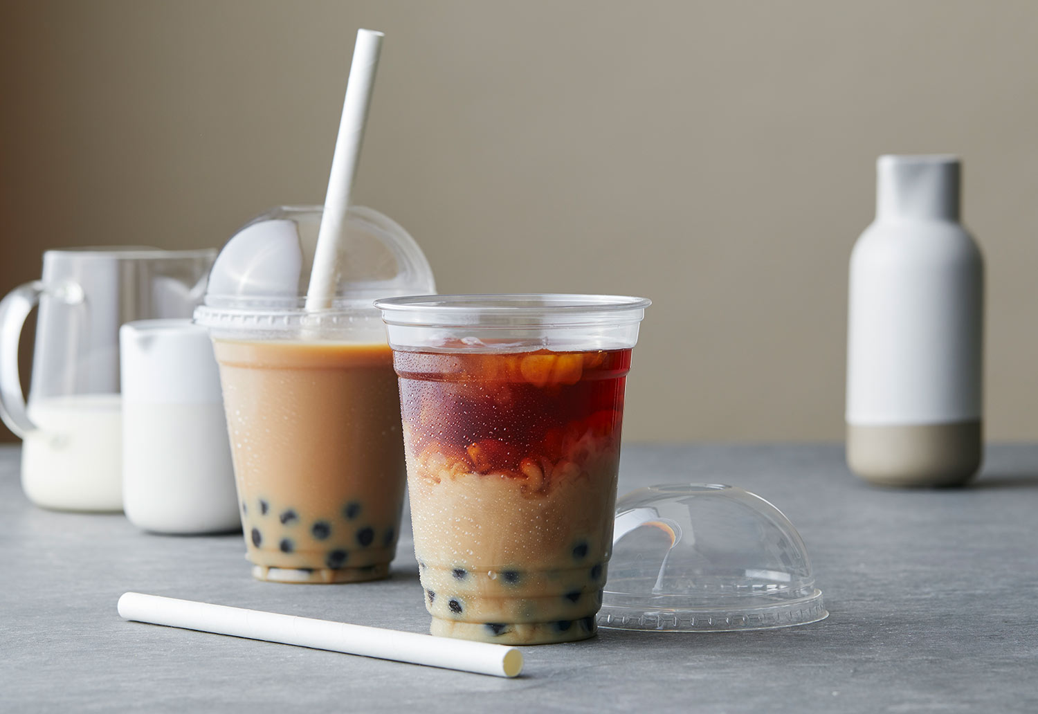 Image of beverage or drink cups sitting on a bench