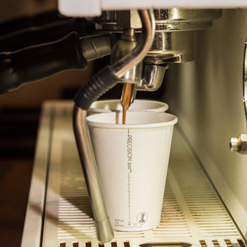Precision Series cup sitting under coffee machine
