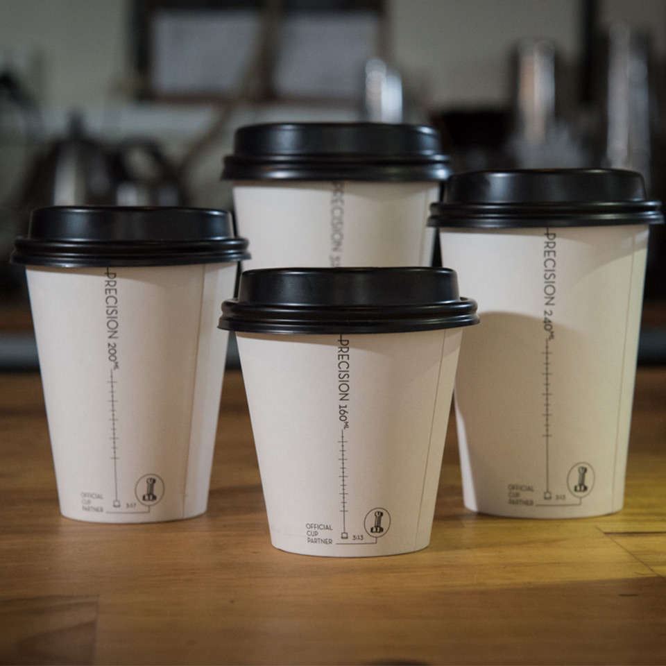 Image shows the four different Precision Series takeaway cup sizes in a group shot on a table